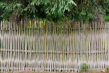 Rustic wicker fence. Rural background