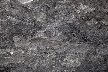 thin shards of ice on a frosty spring day form beautiful patterns of light and shadow