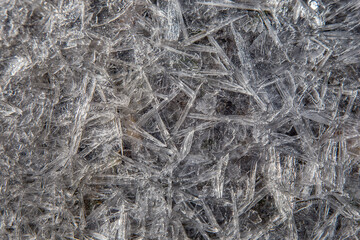thin shards of ice on a frosty spring day form beautiful patterns of light and shadow