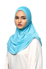 Muslim woman in hijab looking at camera isolated on white