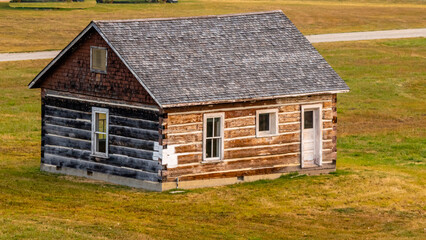 Rustic farm buildings and equipment. Bar U Ranch National Historic Site, Alberta, Canada