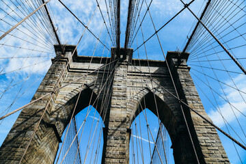 Low angle view of Brooklyn Bridge in New York City. Iconic View of NYC