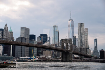 Naklejka premium Iconic View of New York City with Brooklyn Bridge, East River and Downtown of Manhattan