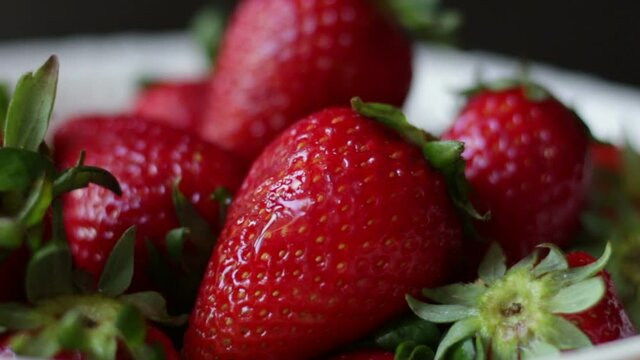 Fresh strawberries in white bowl
