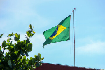 Brazilian flag flying in the open air in Rio de Janeiro.