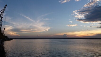 Obraz premium sunset over the river