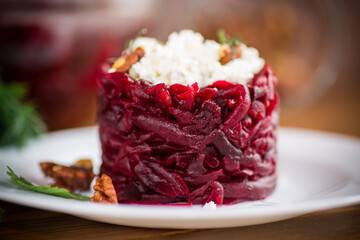 dietary salad of boiled beets with walnuts and cottage cheese