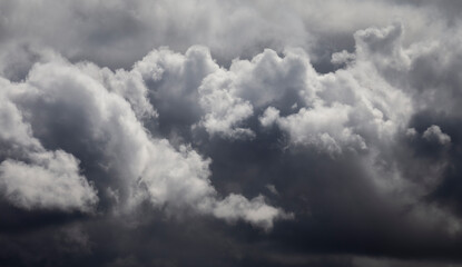 Cloudy dark blue sky abstract background in a stormy day.