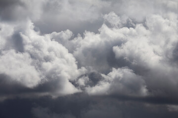Cloudy dark blue sky abstract background in a stormy day.