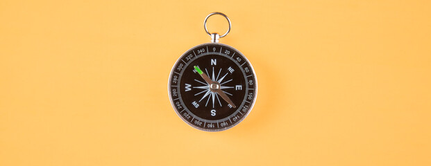 compass on orange background