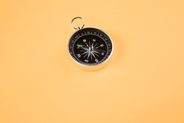 compass on orange background