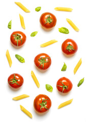 Fototapeta premium Top view of penne pasta, cherry tomatoes and basil leaves arranged on white background.Mediterranean cookery ingredients.