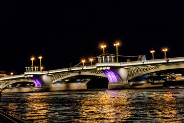 Fototapeta na wymiar Annunciation bridge across the Neva river in Saint Petersburg, Russia. Night view
