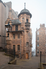 The Writers' Museum in atmospheric and moody, misty fog in old town Edinburgh, Scotland.