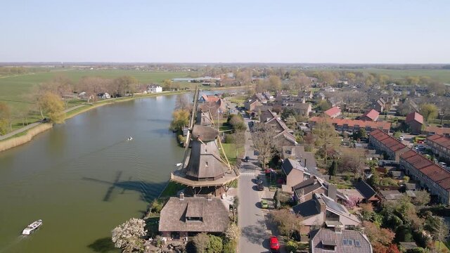 Weesp small city in North holland, The Netherlands, city view along the water aerial drone footage.