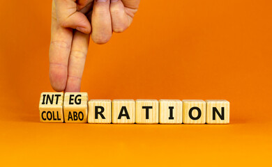 Integration or collaboration symbol. Businessman turns cubes, changes words 'collaboration' to 'integration'. Beautiful orange background. Business, integration or collaboration concept. Copy space.