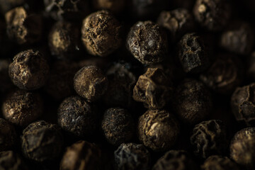 full size near close up of group of dried peppercorns 