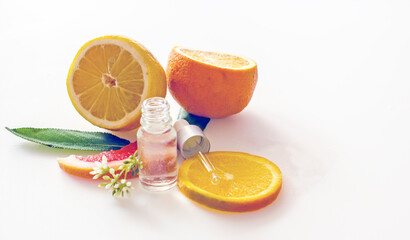 Orange essential oil in a bottle with a pipette, Copy Space. Citrus aromatherapy background
