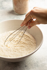 weighing flour for a cake on a scale. Home cooking