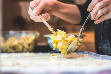 Preparing traditional Austrian apple strudel in the kitchen, close up