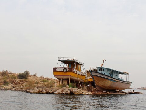 Small colorful boats on the shore of Naser lake in Aswan in Egypt