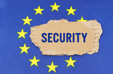 There is a cardboard box on the EU flag that says- SECURITY