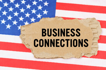 On the US flag lies a cardboard box with the inscription - BUSINESS CONNECTIONS