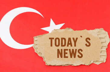 Against the background of the flag of Turkey lies cardboard with the inscription - Todays News