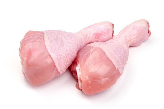 Raw chicken drumsticks, isolated on white background. High resolution image