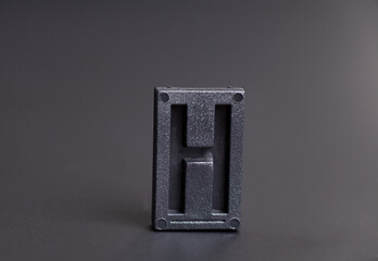 Letter Press H on black background
