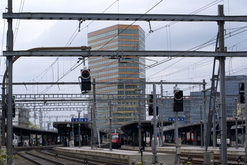Railway station Zurich Oerlikon with skyscraper Andreasturm (Andreas tower) in the background. Photo taken April 29th, 2021, Zurich, Switzerland.