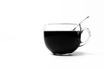 Transparent cup of coffee standing on white background