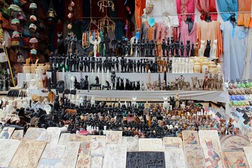 A souvenir bazaar selling statues and clothes in the middle of Aswan streets in Egypt