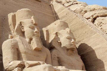 The great entrance of Abou Simbel temple in Egypt with huge statues in the doorway