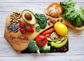 Food for healthy eyes and good eyesight. Natural products to boost eye health and improve eyesight. Assortment of food for good vision. Fresh fruit and vegetable rich in antioxidant, lutein zeaxanthin