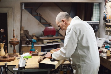 Cabinetmaker working with a wooden board