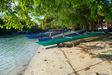 Boats on the beach of the small island of Poyalisa which is part of the Togian archipelago on Sulawesi. The Togian Islands in the Gulf of Tomini are a paradise for divers and snorkelers