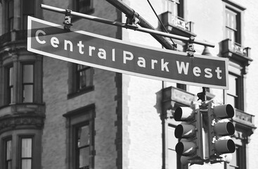 Black and white picture of Central Park West street sign, selective focus, New York City, USA.