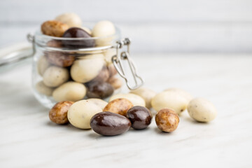 Sweet chocolate almonds. Chocolate eggs.