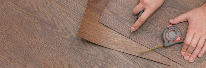 Vinyl flooring installation. Easy installation and cutting with a knife, Master cuts vinyl plank...