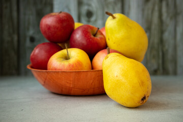 Fresh garden bio healthy, natural fruits, apples and pears in a heap on the plate is a juicy snack