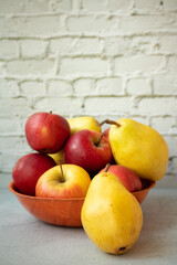 Fresh garden bio healthy, natural fruits, apples and pears in a heap on the plate is a juicy snack