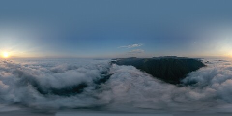 Fototapeta na wymiar Mountains above the clouds beautiful sunset