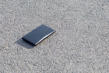 Street lighting. there is a wallet on the road on a sunny summer day