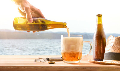 Serving in a beer mug on table with seaside background.