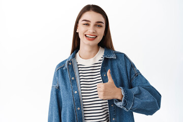 Very good, nice work. Girl praise great choice, smiles and shows thumbs up. Teenage female model...