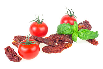 Delicious dried tomatoes and fresh basil isolated on a white background. Sun dried tomatoes.