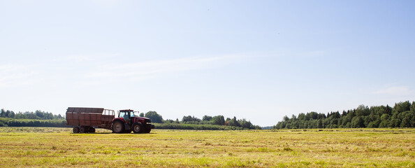 Tractor in the field for agricultural work. 