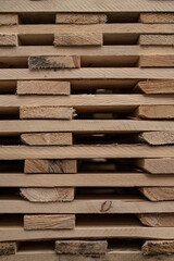Stack of wooden pallets at warehouse