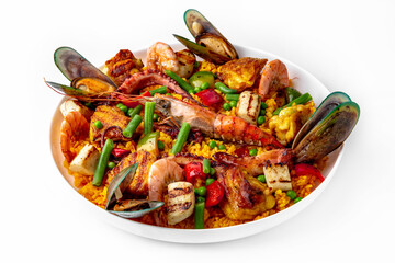 Paella. Spanish dish of rice and seafood, vegetables and chicken. Shrimp, octopus, crab and mussels. Banquet festive dishes. Gourmet restaurant menu. White background.